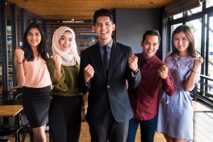 Multi-ethnic group of business team standing tall and togetherness as leaders of the business world